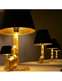 Gun bedside table lamp design Flos gold or black color side view